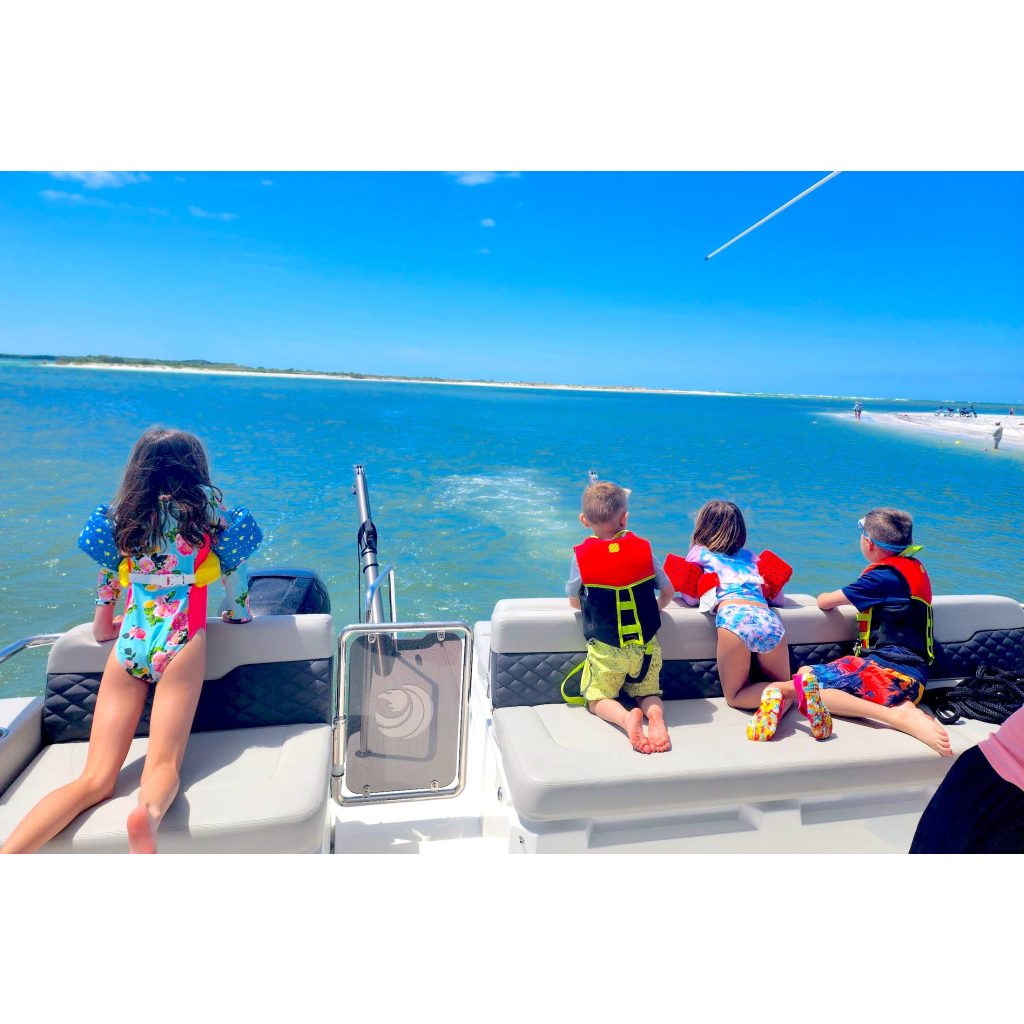 Happy family with children enjoy adventure on a yacht at sea Let's Get underway Tampa Bay Yacht rentals