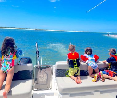 Happy family with children enjoy adventure on a yacht at sea Let's Get underway Tampa Bay Yacht rentals